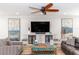 Comfortable living room with stylish furnishings, a large TV, and artistic decor at 435 Jessamine Ave, New Smyrna Beach, FL 32169