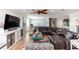 Spacious living room featuring a large sectional, stylish decor, and ample natural light at 435 Jessamine Ave, New Smyrna Beach, FL 32169
