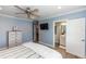 Comfortable main bedroom featuring blue walls, white trim, and a ceiling fan at 435 Jessamine Ave, New Smyrna Beach, FL 32169