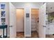 Pantry with white wire shelving, ample storage space, and a fire extinguisher to protect against fire hazards at 435 Jessamine Ave, New Smyrna Beach, FL 32169