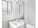 Bright bathroom featuring a single vanity with white cabinets and a modern faucet at 4425 Signal Hill Rd, Orlando, FL 32808