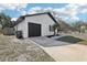 Exterior view of home featuring a single car garage and manicured lawn at 4425 Signal Hill Rd, Orlando, FL 32808
