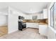 Bright kitchen showcasing stainless steel appliances, ample cabinets, and an adjacent dining area at 4425 Signal Hill Rd, Orlando, FL 32808