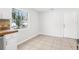 Bright kitchen showcasing stainless steel appliances, white cabinets, and an eating area at 4425 Signal Hill Rd, Orlando, FL 32808
