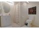Bathroom featuring a shower, round mirror, vanity with white cabinets and decorative art piece at 450 Lakewood Dr, Winter Park, FL 32789