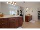 Elegant bathroom featuring dual vanities, tile flooring, and an expansive mirror at 450 Lakewood Dr, Winter Park, FL 32789