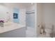 Bright bathroom with white cabinets, tile floors, and a shower with a glass door at 450 Lakewood Dr, Winter Park, FL 32789