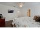 Bedroom with hardwood floors, ceiling fan, and a TV on the wall at 450 Lakewood Dr, Winter Park, FL 32789