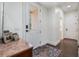 Entryway featuring a marble top table, rug and access to other rooms in the home at 450 Lakewood Dr, Winter Park, FL 32789
