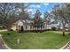 Charming home featuring a manicured lawn and beautiful landscaping at 450 Lakewood Dr, Winter Park, FL 32789