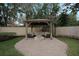 Backyard gazebo with outdoor seating and a fire pit at 450 Lakewood Dr, Winter Park, FL 32789