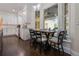 Bright kitchen features white cabinets, marble backsplash, stainless appliances, and eat-in nook with large bay window at 450 Lakewood Dr, Winter Park, FL 32789