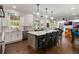 Spacious kitchen with modern appliances, a central island with seating, and access to a dining area at 450 Lakewood Dr, Winter Park, FL 32789