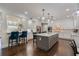 The open kitchen is complete with a large central island, ample counter space, and high end appliances at 450 Lakewood Dr, Winter Park, FL 32789