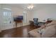 Living room with hardwood floors, shuttered windows, a ceiling fan, and comfortable seating at 450 Lakewood Dr, Winter Park, FL 32789