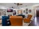 Bright living room featuring a fireplace, built-in shelves, comfortable seating, and access to outdoor spaces at 450 Lakewood Dr, Winter Park, FL 32789
