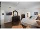 A spacious main bedroom with hardwood floors, ceiling fans, and an ensuite bathroom at 450 Lakewood Dr, Winter Park, FL 32789