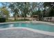 Backyard oasis with a pool, spa, and gazebo, perfect for outdoor entertaining at 450 Lakewood Dr, Winter Park, FL 32789