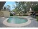 Beautifully designed pool and spa in a secluded backyard setting with lush landscaping at 450 Lakewood Dr, Winter Park, FL 32789