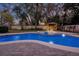 Beautiful backyard pool with spa and a charming gazebo, surrounded by greenery at 450 Lakewood Dr, Winter Park, FL 32789