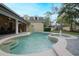 Stunning pool with attached spa in a private backyard oasis featuring a covered lanai at 450 Lakewood Dr, Winter Park, FL 32789