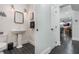 Powder room with pedestal sink and access to the home's interior at 450 Lakewood Dr, Winter Park, FL 32789