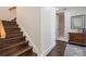 Staircase featuring dark wood steps, white risers, and white banisters at 450 Lakewood Dr, Winter Park, FL 32789