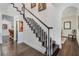 Staircase featuring dark wood steps, white risers, and white banisters at 450 Lakewood Dr, Winter Park, FL 32789