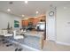 Bright kitchen features a breakfast bar and stainless steel appliances at 4879 Clock Tower Dr, Kissimmee, FL 34746