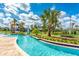 Relaxing lazy river with tubes, lush greenery, and a mini golf course for endless entertainment at 4879 Clock Tower Dr, Kissimmee, FL 34746