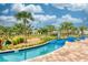 Tranquil lazy river winding through a lush, tropical landscape with mini golf in the background at 4879 Clock Tower Dr, Kissimmee, FL 34746