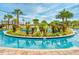 Scenic lazy river surrounded by tropical plants and a beautifully landscaped island at 4879 Clock Tower Dr, Kissimmee, FL 34746