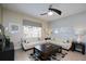 Cozy living room with neutral paint, a ceiling fan and comfortable seating area at 4879 Clock Tower Dr, Kissimmee, FL 34746