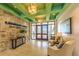 Inviting lobby with modern decor, comfortable seating, stone accent wall and stylish lighting fixtures at 4879 Clock Tower Dr, Kissimmee, FL 34746