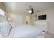 Spacious main bedroom featuring a ceiling fan and large walk in closet at 4879 Clock Tower Dr, Kissimmee, FL 34746