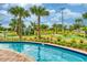Well-manicured miniature golf course surrounded by lush landscaping and a tranquil lazy river at 4879 Clock Tower Dr, Kissimmee, FL 34746