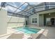 Beautiful pool with a screened enclosure and lounge chairs at 4879 Clock Tower Dr, Kissimmee, FL 34746