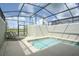 Gorgeous pool with a screened enclosure and lounge chairs at 4879 Clock Tower Dr, Kissimmee, FL 34746