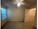 Bedroom with a ceiling fan, window, and walk-in closet for ample storage at 5120 Conroy Rd # 513, Orlando, FL 32811