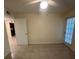 Bedroom featuring tile flooring and a glass door leading to a patio or balcony at 5120 Conroy Rd # 513, Orlando, FL 32811
