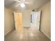 Bedroom with a large tile floor and access to a walk-in closet at 5120 Conroy Rd # 513, Orlando, FL 32811