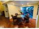 Dining area leading to gym with ample seating and hardwood floors at 5120 Conroy Rd # 513, Orlando, FL 32811