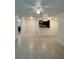 Bright living room with tile flooring that leads to a modern kitchen with stainless steel appliances at 5120 Conroy Rd # 513, Orlando, FL 32811