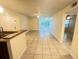 Spacious, brightly-lit living room featuring tile floors that lead to a cozy sun room at 5120 Conroy Rd # 513, Orlando, FL 32811