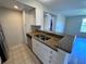 Well-appointed kitchen features stainless steel appliances and granite countertops at 5128 Conroy Rd # 725, Orlando, FL 32811