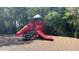 A colorful playground surrounded by trees, perfect for to enjoy outdoor activities at 5128 Conroy Rd # 725, Orlando, FL 32811