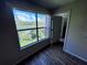 Bedroom view featuring lush greenery and a serene lake view at 5128 Conroy Rd # 725, Orlando, FL 32811