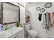Bathroom features vanity, toilet, subway tile in shower, and modern decorative elements at 5201 Vineland Rd # 112, Orlando, FL 32811