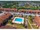 A beautiful community pool area with lounge chairs and landscaping located in a condo community at 5201 Vineland Rd # 112, Orlando, FL 32811