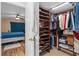 Organized walk-in closet with custom shelving and plenty of storage space, adjacent to the primary bedroom at 5201 Vineland Rd # 112, Orlando, FL 32811